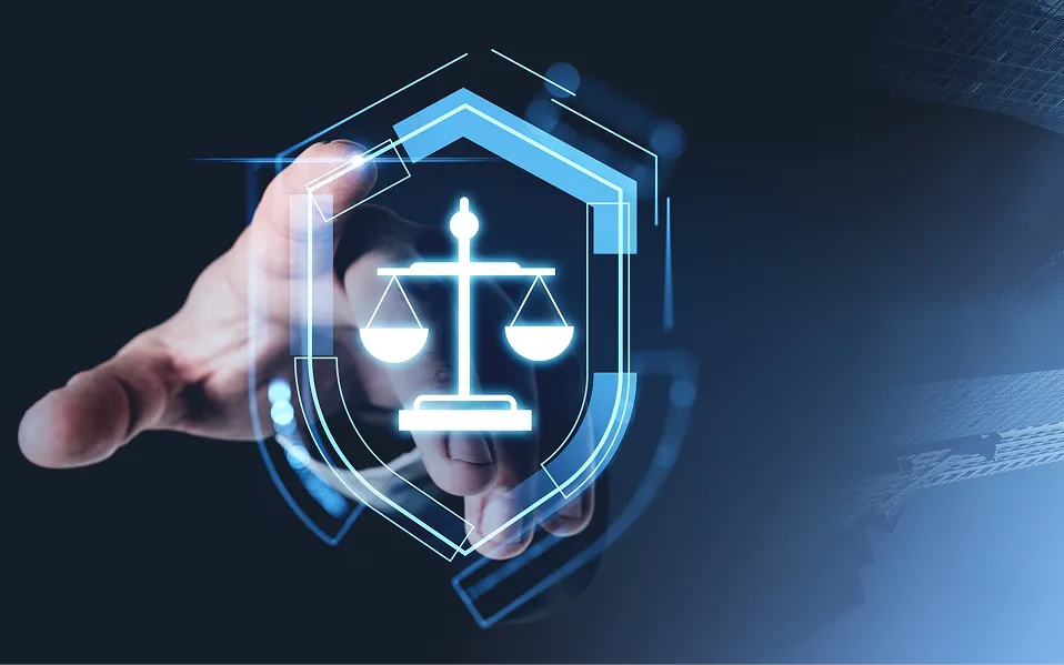 Hand reaching towards glowing blue scales of justice icon within a digital shield interface.